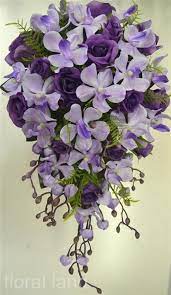 Silver or other metal decorations are added on some fake bridal bouquets to give them a more luxurious the round bouquet: Silk Wedding Bouquet Artificial Flower Purple Lilac Rose Orchid Teardrop Flowers Wedding Table Flowers Wedding Bouquets Silk Wedding Bouquets