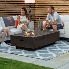 Because fire pit tables are tables. Fireglow Cairns Rectangle Firepit Coffee Table Wind Guard
