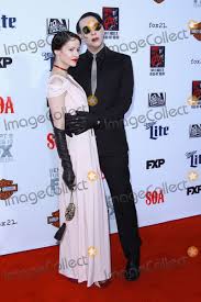 When he originally got involved with kurt sutter and sons of anarchy, marilyn manson only thought he was going to do a song for the show, not become a major character in the show's final season. Photos And Pictures 06 September 2014 Hollywood California Lindsay Usich Marilyn Manson Sons Of Anarchy Premiere At Tcl Chinese Theatre Photo Credit F Sadou Admedia