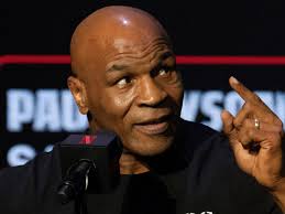 Mike Tyson shouts ‘where’s this kid’s mother?’ as 14-year-old asks lewd  question at his and Jake Paul’s press