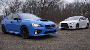 Subaru Impreza Wrx Sti Vs Mitsubishi Lancer Evolution X Pin On Sports Cars