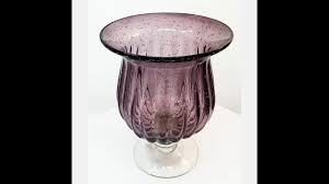 Cutlass ii is a pair of candle holders with a antiqued gold finish on the metal bases and a large glass hurricane sleeves. New 10 X 7 5 Hand Blown Glass Purple Hurricane Candle Holder And Vase Youtube