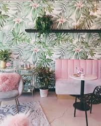 Image about photography in pictures for bedroom(print them out) by music_inn28. Bold Tropical Inspired Living Space With Pink Accents And Green Leaf Wallpaper Green Leaf Wallpaper Jungle Interior Design Living Room Designs