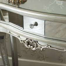 Placed in the monochromatic color scheme of wall and vase shaped lamp creates a beautiful composition. Half Moon Console Table Tiffany Range