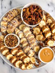 How To Make Banana Sushi Rolls The Best Snack Ever Banana Sushi Banana Sushi Rolls Healthy Banana Recipes