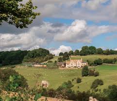 Different stains and finishes can be applied to the hewn wood for an authentic aged look. Building The Perfect English Countryside Home Vogue
