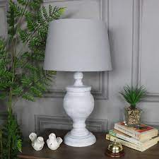 Find a base and shade that pairs with other decor in the room like your vases and desk accessories. Rustic Antique White Table Lamp