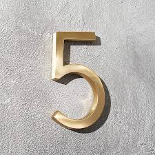 House numbering is the system of giving a unique number to each building in a street or area, with the intention of making it easier to locate a particular building. Aurele 6 Brushed Brass House Number 5 Reviews Cb2