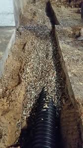 We dug a trench below the top of the footing, laid. French Drain Waukesha Basement Waterproofing Pewaukee Drain Tile Milwaukee Foundation Repair Delafield Water Damage Sussex Rion Llc Oconomowoc Wisconsin