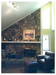 From the photos, the stone looks natural and not at all painted. Paint The Fireplace Rock Or Not