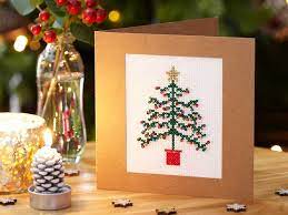 Some cross stitchers love to plan their christmas sittching throughout the year; How To Make A Cross Stitch Christmas Tree Card