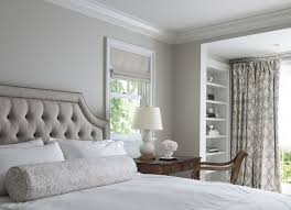 Traditional Master Bedroom Features Light Gray Walls Framing A Gray Tufted Velvet Bed Dressed In Soft White Be Bedroom Design Luxe Interiors Light Gray Bedroom