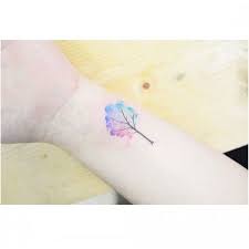 This tattoo is simply a nod to the patronus imagery that i connected so well with growing up. Watercolor Tree Tattoo Tiny Wrist Tattoo On Tattoochief Com Tiny Tree Tattoo Tree Tattoo Small Watercolor Tattoo Tree