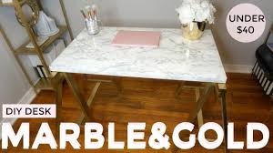 I also used a side table that was sitting in storage unused and it was the perfect size and colour for the ikea basket! to create the coffee table, michele removed the handles from the basket using a pair of. Gold And Marble Diy Under 40 Desk Ikea Hack Youtube