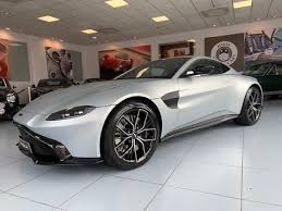 Image result for Titanium Silver 2011 Aston Martin