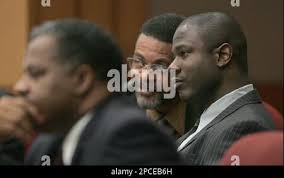 Defendant Brian Nichols, right, sits with his attorneys, Henderson Hill,  left, and Gary Parker, as they listen to testimony in Fulton County  Superior Court, Tuesday, Oct. 17, 2006, in Atlanta. Nichols is