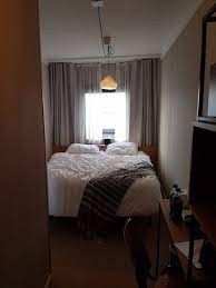 While small windows come with their own set of advantages, large windows usually tend to gather more pros especially when it comes to bedrooms. Bedroom With Small Window And Tiny Space Either Side Of The Bed Picture Of Good Hotel London London Tripadvisor