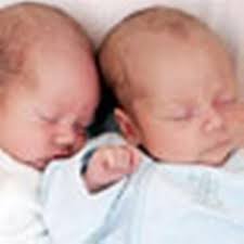 Twins survive surgery in the womb