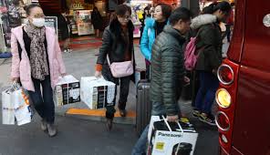 A man stands in front of a screen displaying. Chinese Tech Startups Eye Japan S Real Estate And Tourism Sectors Nikkei Asian Review Windowswear