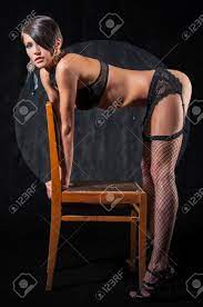 Sensual Brunette Woman Bent Over Chair, Posing In Sexy Underwear Stock  Photo, Picture and Royalty Free Image. Image 55046682.