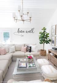 This method of decorating a large wall doesn't actually involve decorating the wall at all — but positioning some of your decor in front of the wall which takes up wall space. 6 Living Room Wall Decor Ideas Say Goodbye To Those Bare Walls Driven By Decor