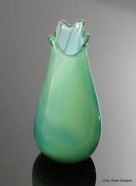 While the gorgeous bird adds color and life to your garden, the spiraling metal finial adds an extra touch of elegance. Tall Green Blown Glass Vase Ii Lilley Glass Designs