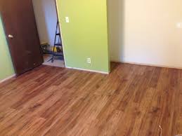Distressed Brown Hickory Pergo Flooring And Behr S Asparagus Paint From Home Depot Pergo Flooring Flooring New Homes