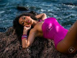 Portrait Of Cheerful Black People, Pretty Happy Young Afro American Woman  Smiling On Sea Beach. Sexy Girl In Pink Swimsuit And Jewelry Enjoying  Nature.Lady Wearing Bikini. Stock Photo, Picture and Royalty Free