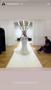 Kim kardashian of keeping up with the kardashians fame recently posted a throwback pic of the wedding dress she wore when she tied the knot with kanye west. Kim Kardashian Posts Throwback Wedding Dress Photos From 2014