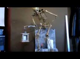 This is a great idea if you love to change your outdoor décor for the seasons. Leering Skeleton Tombstone Youtube Halloween Props Diy Halloween Fence Halloween Animatronics