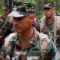 US Navy 081011-N-4307V-001 Chief Steelworker Jeff Epstein demonstrates the  proper way to approach an enemy prisoner of war