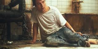 Billy es un títere y uno de los protagonistas de la saga de saw. Imagenes Pelicula Saw El Juego Macabro
