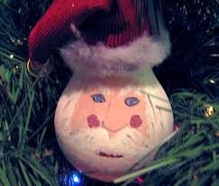 Your artificial tree becomes the perfect canvas for your favorite christmas ornaments and christmas lights. Recycled Light Bulb Santa