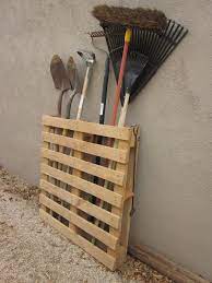 Cut the boards to the width of the pallet. Using Ordinary Pallets In A Fantastic Garden Garden Tool Storage Diy Furniture Projects Pallet Diy