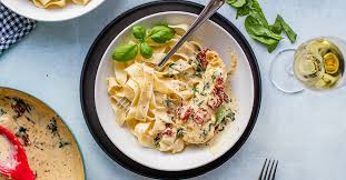 I'd always figured fettuccine alfredo was about as authentically italian as an ellio's frozen pizza; Creamy Tuscan Chicken With Spinach And Sun Dried Tomatoes Nourish And Fete
