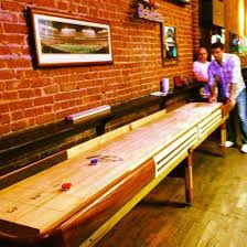 Perhaps One Of The Best Bar Games Of All Time Shuffleboard You And Your Teammate Will Slide Round Blue And Red Discs Across A Sawd Cool Bars Game Room Home