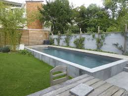 In 11 simple steps, learn how to remove a winter safety cover, set up your pump and filter, and shock your above. Pin By Kacy Wright On Backyard Ideas Pool Landscaping Concrete Swimming Pool Small Backyard Pools