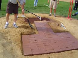 The #4 portable baseball mound has a thin edge all around to protect the pitcher from falling. Moundmaster Blocks Turface Athletics