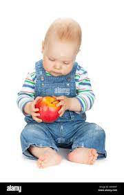 Small Baby Boy Holding An Apple Isolated On White Background Stock Photo Alamy