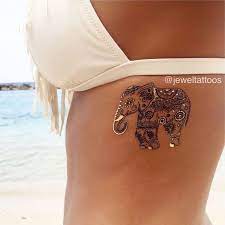 60 Best Elephant Tattoos Meanings Ideas And Designs Metal Tattoo Jewelry Tattoo Tattoos