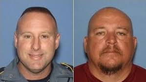 Former officers charged after drawing weapons at bar