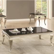 It is characterized by curvy legs and often includes carved shell and scroll motifs. Glam Coffee Table With Queen Anne Legs