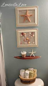 Continue to 9 of 15 below. Beach And Coastal Decor Bathroom And There You Have It A Very Simple Beach Bathroom Makeov Beach Bathroom Decor Seashell Bathroom Decor Beach Theme Bathroom