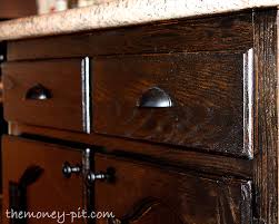 When you've created a smooth surface, apply a coat of stain with a clean cloth. My New Kitchen Island Staining Oak Cabinets The Kim Six Fix
