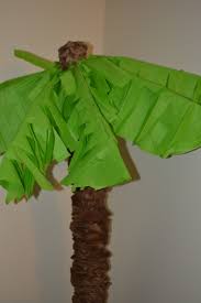 This would add more festive air and cheer to your home this holiday adorn your christmas home with this green christmas tree dressed up using cream ribbon, silver and gold ornaments with flowers. Make Your Own Palm Trees With Pool Noodles She Bakes And Creates