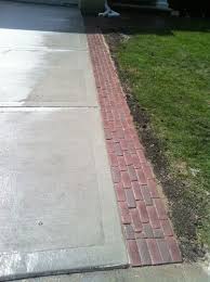 That enabled them to set the stone in a bed of mortar, bringing everything up to the same level. Brick Lined Driveway Google Search Brick Patterns Patio Brick Driveway Brick Patterns