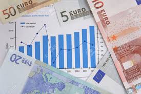 few euro bills over a stock chart