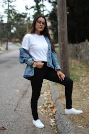Black And White Slip On Vans Outfits College Student At University Of Bridgeport Rocks Black Pants A White Tee An Oversized Deni Trendy Fall Outfits Embroidered Jacket Outfit Jean Jacket Outfits