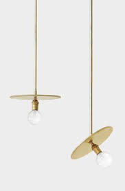 This brass light fixture features a white glass shade within a circular brass frame with six hammered columnar accents. Our Workstead Brass Pendants Looking So Pretty Together Dshop Brass Pendant Light Pendant Light Design Ceiling Light Design