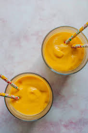 Put the mango, yogurt, milk, and ice cubes into a blender. Mango Lassi This Healthy Table